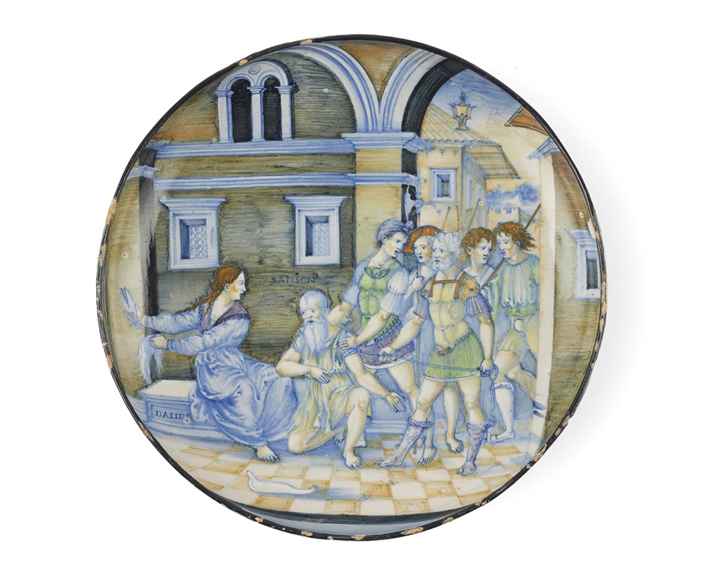 AN UNRECORDED ITALIAN [URBINO] ISTORIATA MAIOLICA DISH, ATTRIBUTED TO NICOLA DA URBINO, CIRCA 1520-23 SAMSON AND DELILAH